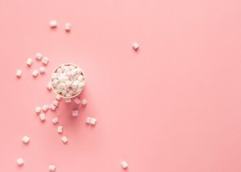 bunch of marshmallows on pink surface